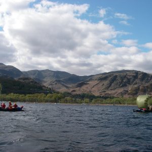 Coniston water with the Coniston fells and some canoe sailing